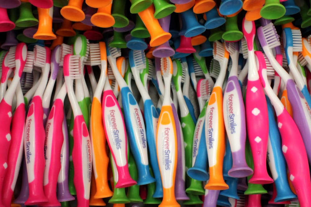 Ordering bulk toothbrushes allows practices to maintain an ample supply of custom dental products at a fraction of the cost of electric options.
